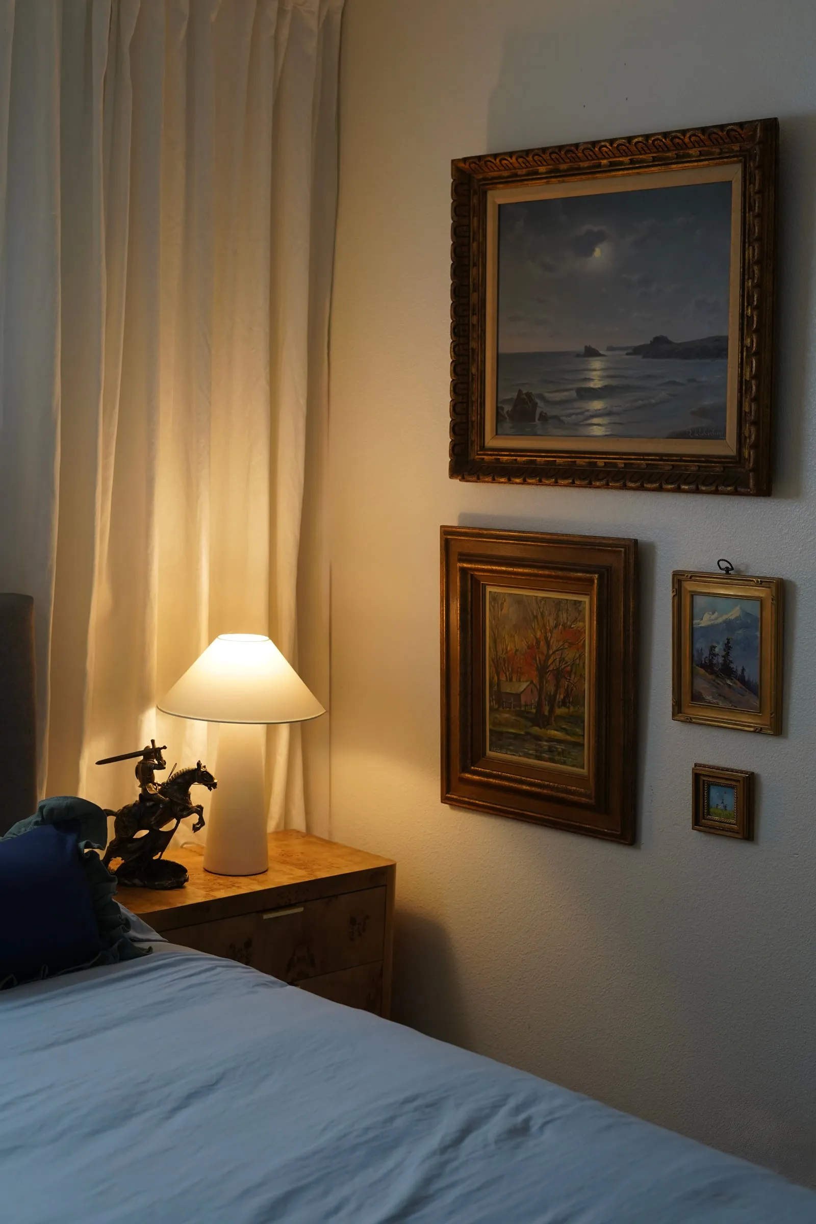 Decorated bedroom with art and lamp