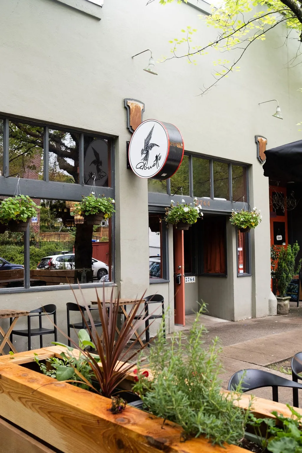 Restaurant storefront with patio planters