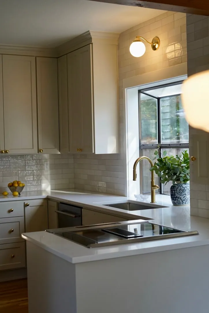 Kitchen with brass faucet and garden window